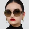 Marie Oversized Sunglasses in Yellow Gold and Grey sold by Linda Farrow