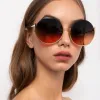 Olivia Round Sunglasses in Yellow Gold sold by Linda Farrow