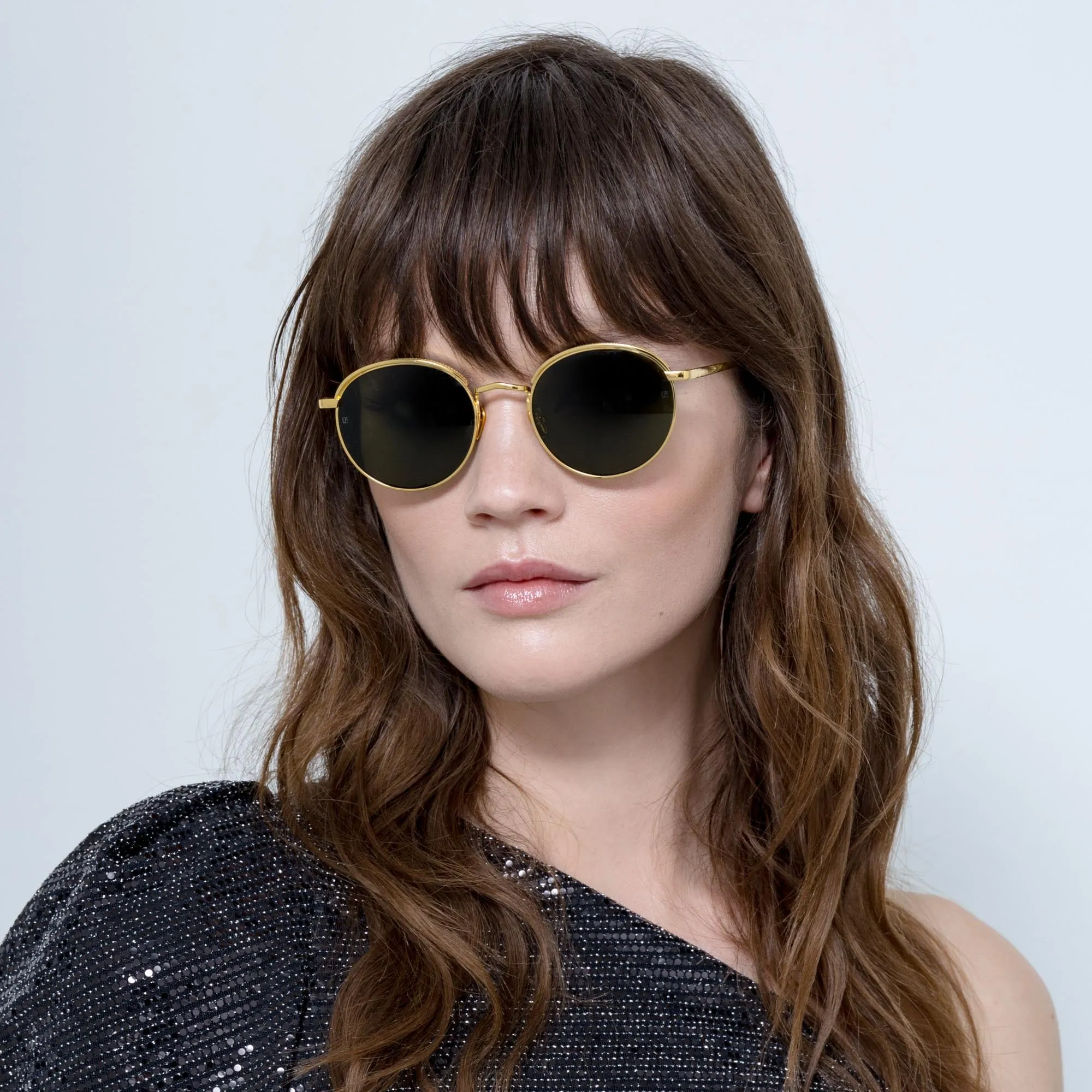 Marlon Oval Sunglasses in Yellow Gold and Green sold by Linda Farrow