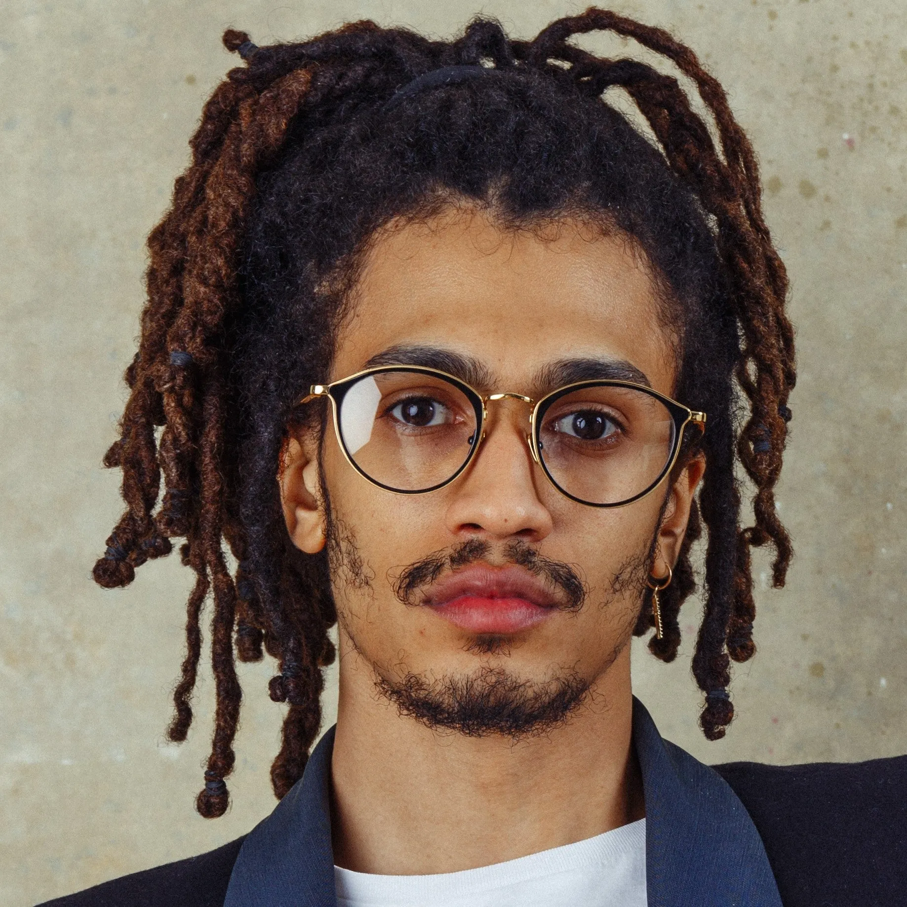 Luis Oval Optical Frame in Yellow Gold and Black sold by Linda Farrow