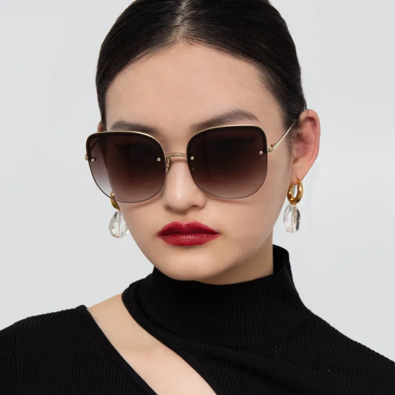 Loni Cat Eye Sunglasses in Light Gold and Grey sold by Linda Farrow