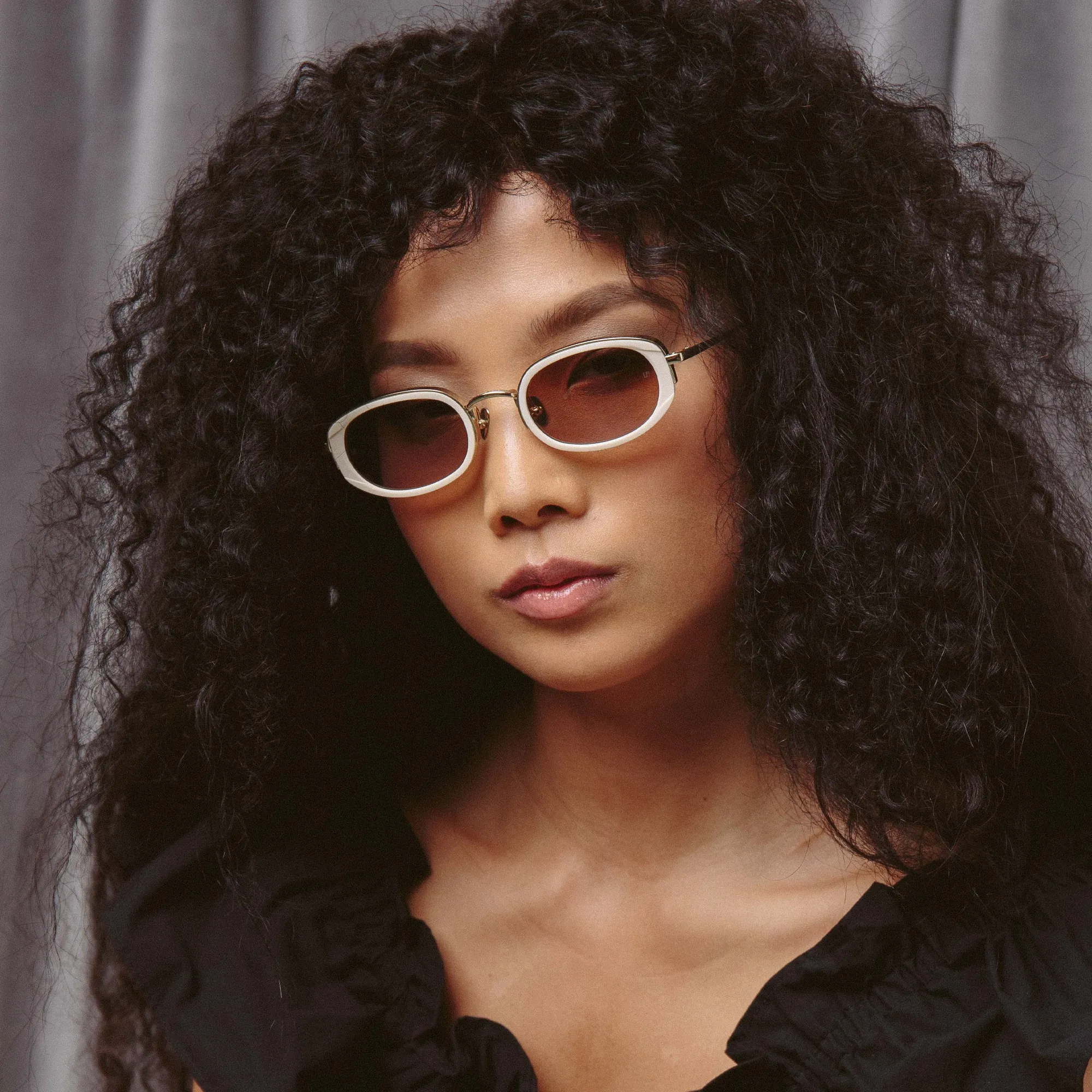 Rosie Oval Sunglasses in Nectarine sold by Linda Farrow