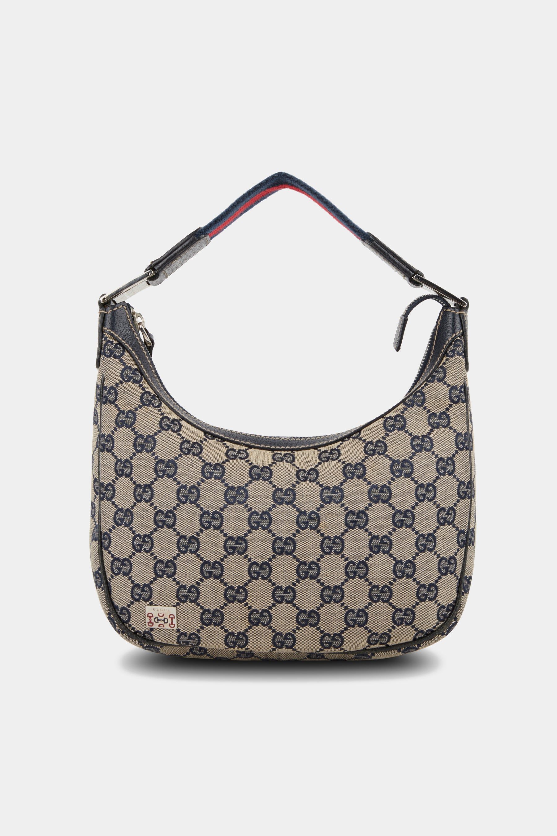 GG Canvas Monogram Top Handle Bag sold by Lord & Taylor