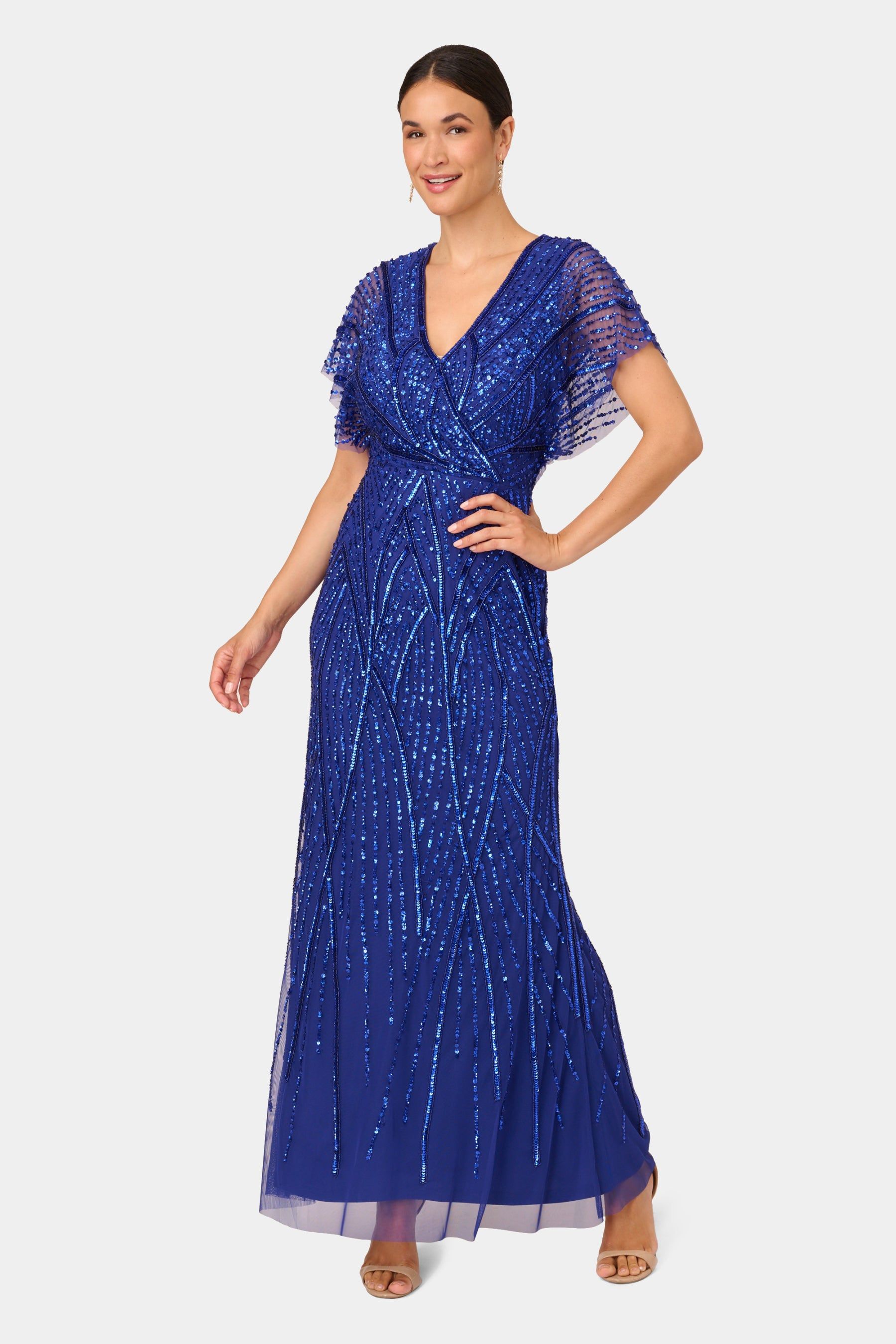 Surplice Neck Beaded Gown sold by Lord & Taylor