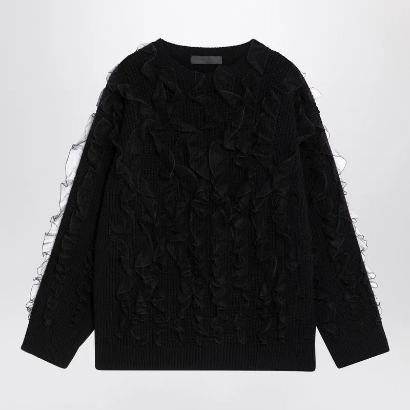 Black jumper with ruffles sold by Lord & Taylor