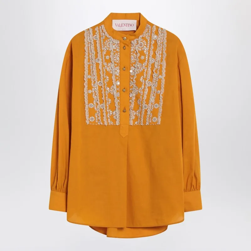 Ochre yellow shirt with beads and lace sold by Lord & Taylor