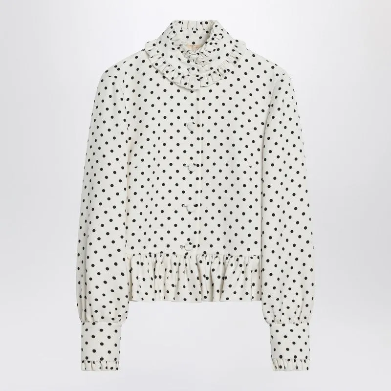 White single-breasted jacket with black polka dots sold by Lord & Taylor