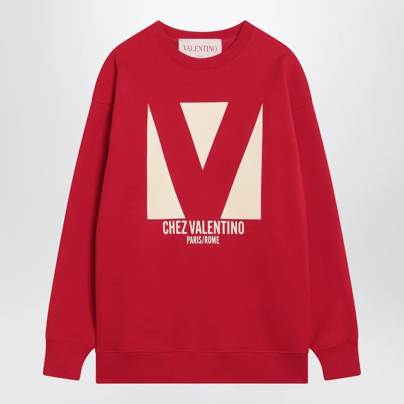 Red sweatshirt with Chez Valentino print sold by Lord & Taylor