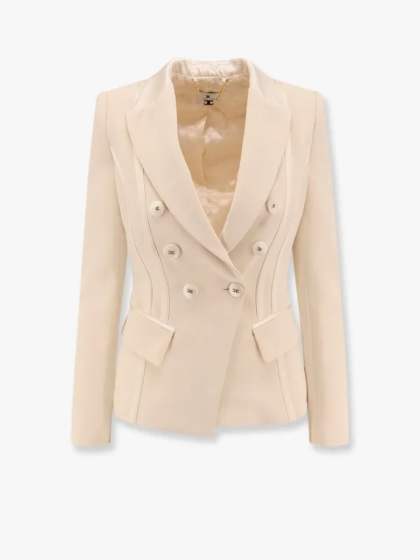 Essentials blazer with shoulder pads and covered buttons sold by Lord & Taylor