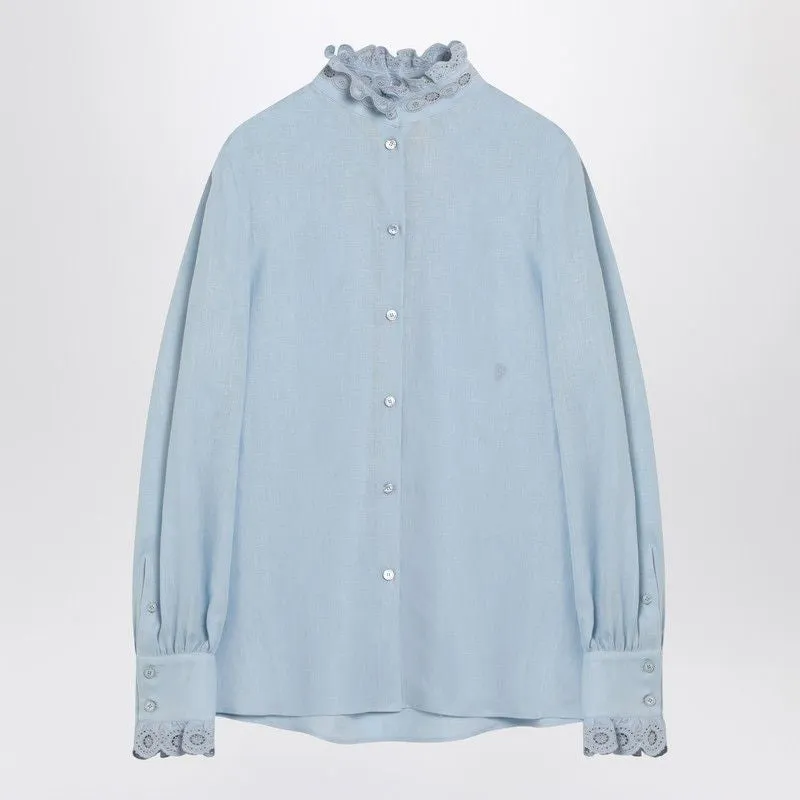 LIGHT BLUE BLOUSE WITH EMBROIDERY ON THE NECK AND CUFFS sold by Lord & Taylor