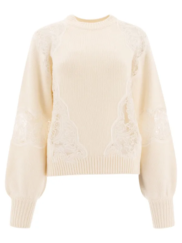 Sweater with lace inserts sold by Lord & Taylor