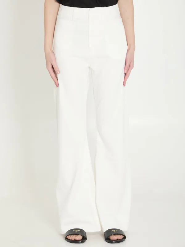 TRIOMPHE FLARED JEANS sold by Lord & Taylor