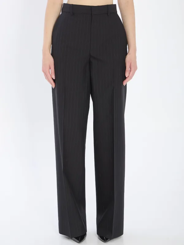 Pinstriped wool trousers made by Gucci