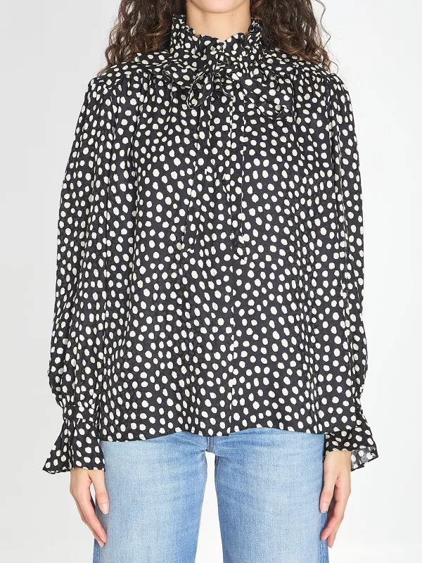 Polka dot blouse with ruffles sold by Lord & Taylor