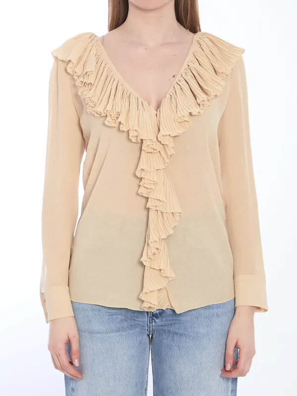 Ruffled blouse sold by Lord & Taylor