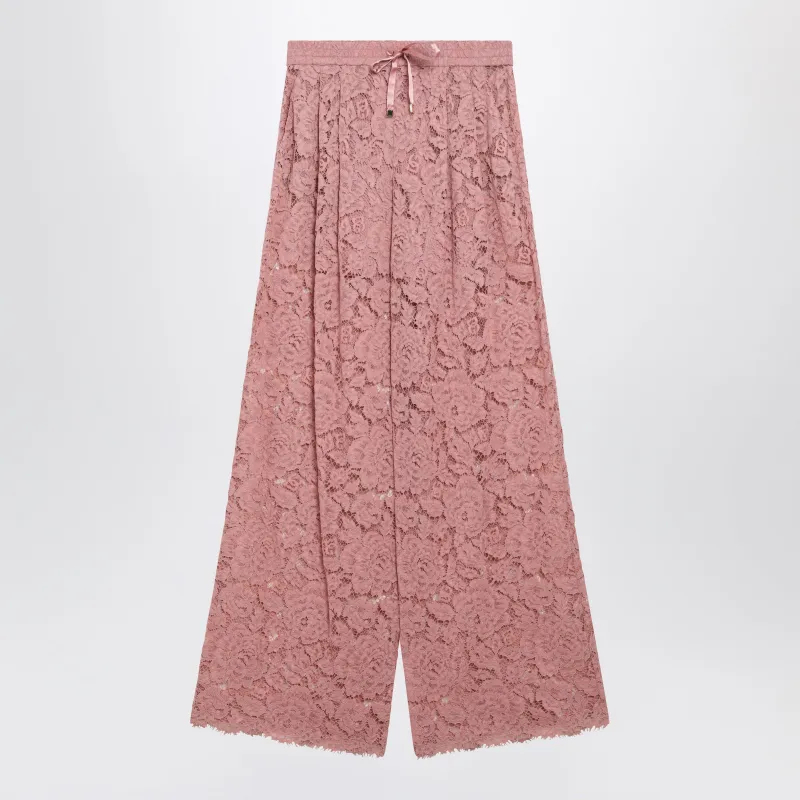 HIGHWAIST FLARED FLORAL LACE PANTS IN DUSTY PINK made by Dolce & Gabanna