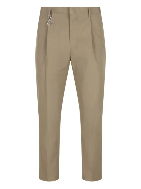 PLEATED COTTON TROUSERS WITH CHARM made by Prada