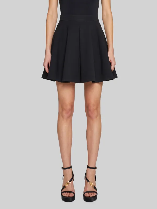 Black natté wool miniskirt made by Versace