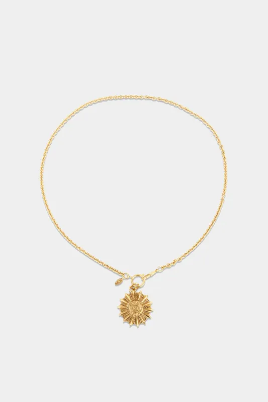 Sunburst CC Pendant sold by Lord & Taylor