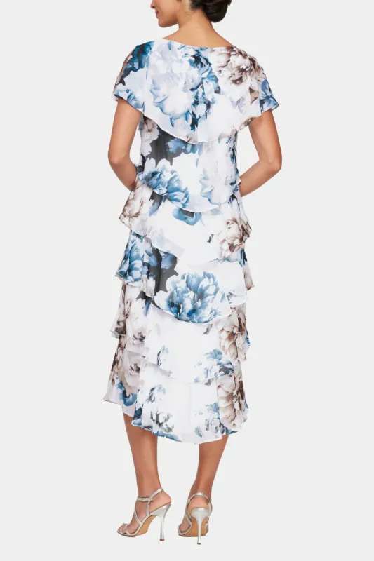 Plus Size Midi Length Printed Tiered Dress With Capelet Sleeves And Embellishment At Shoulders sold by Lord & Taylor