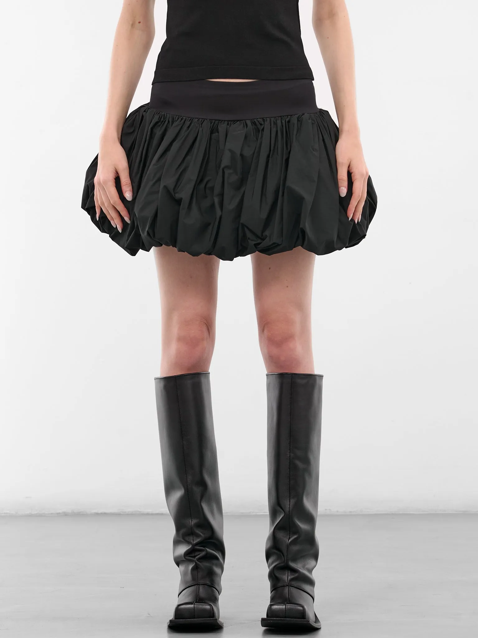 Black Nylon Bubble Mini Skirt (VAQ10S101-BLACK) sold by lorenzo