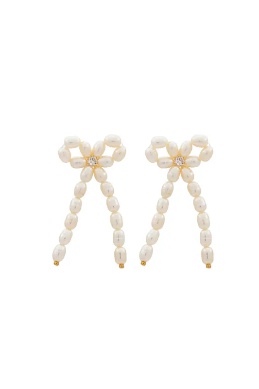 Shashi Bow Pearl Earings sold by LoveShackFancy