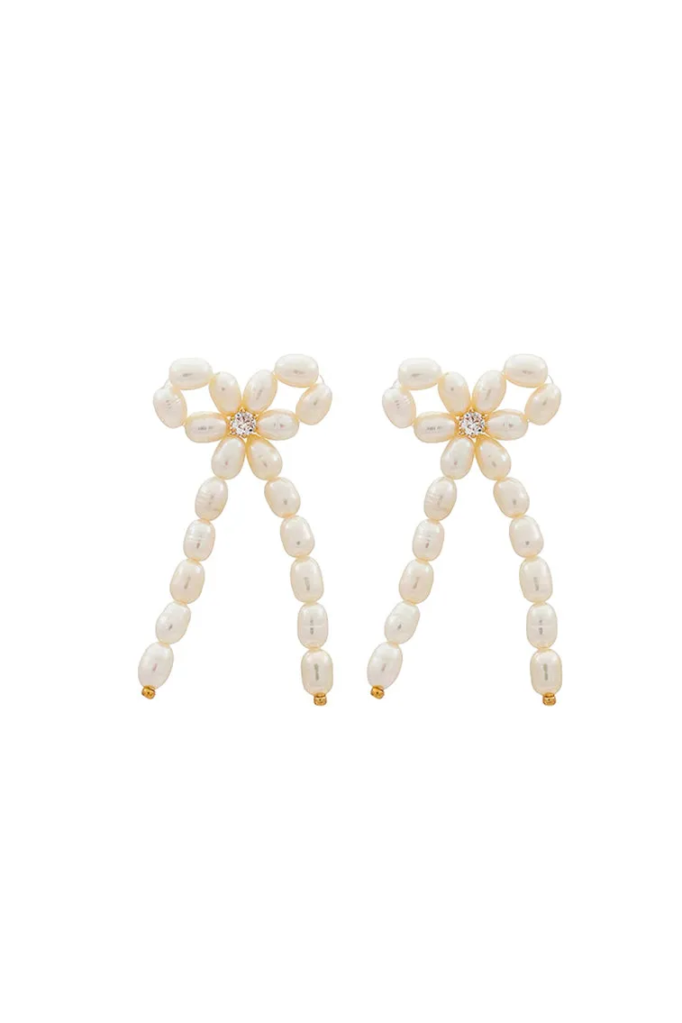 Shashi Bow Pearl Earings sold by LoveShackFancy