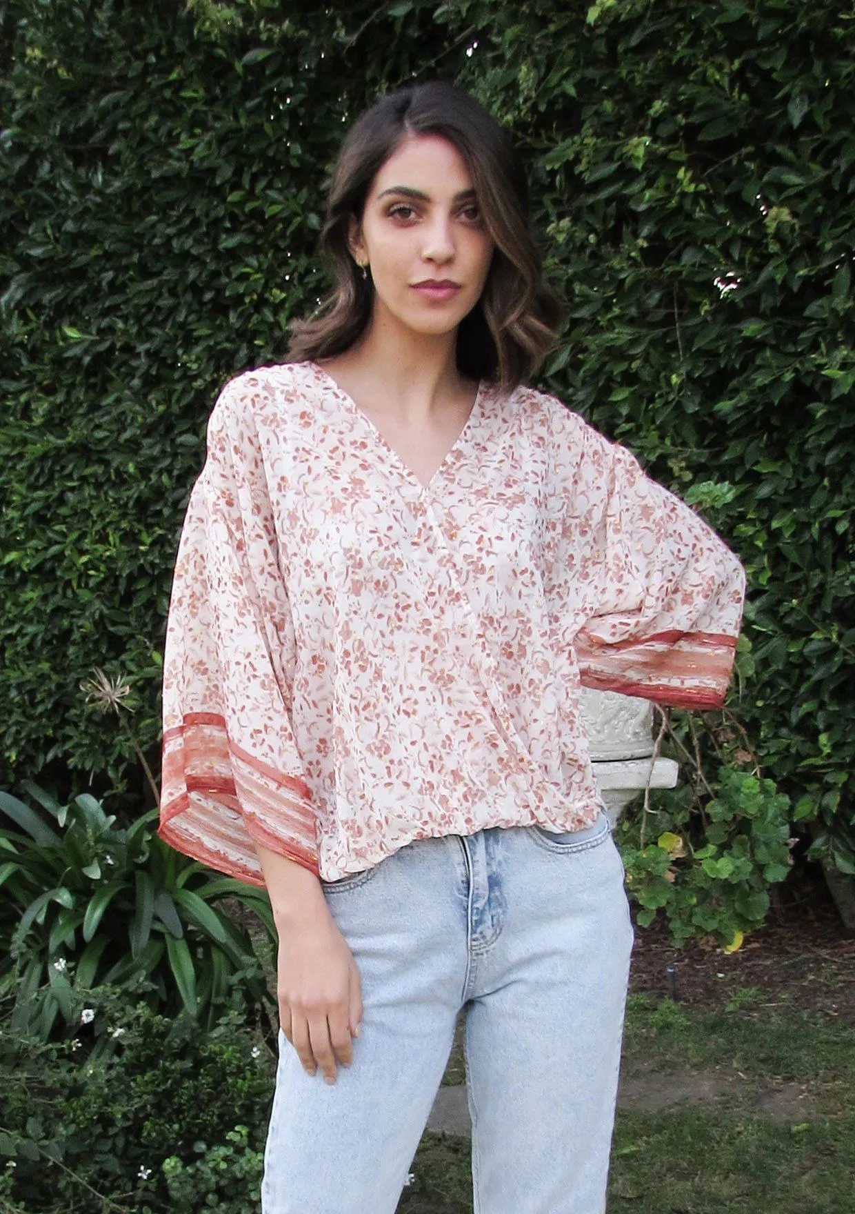 All That Glitters Metallic Floral Surplice Top sold by lovestitch
