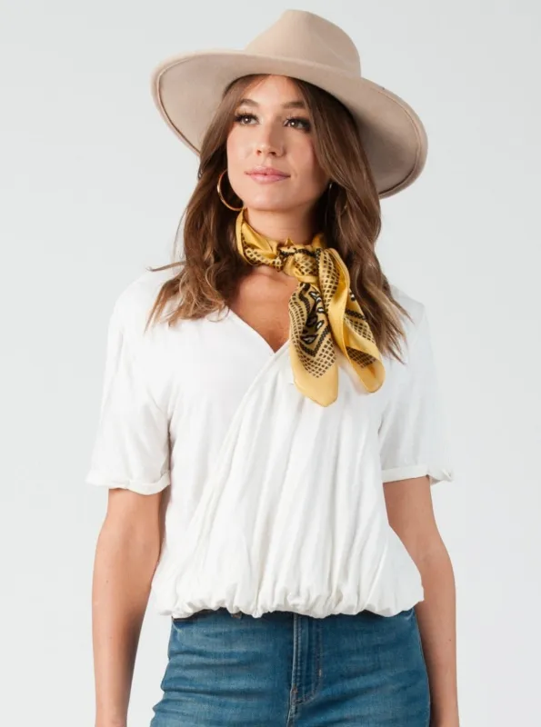 CALLIE SURPLICE DRAPE FRONT TOP-WHITE sold by Lucca Couture