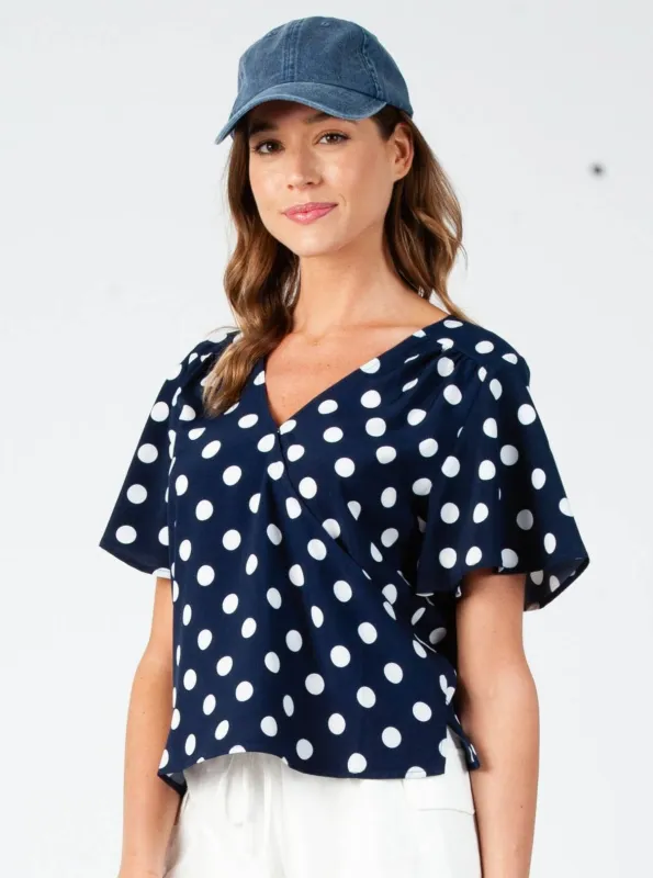 KIM WRAP TOP-NAVY/WHT DOT sold by Lucca Couture