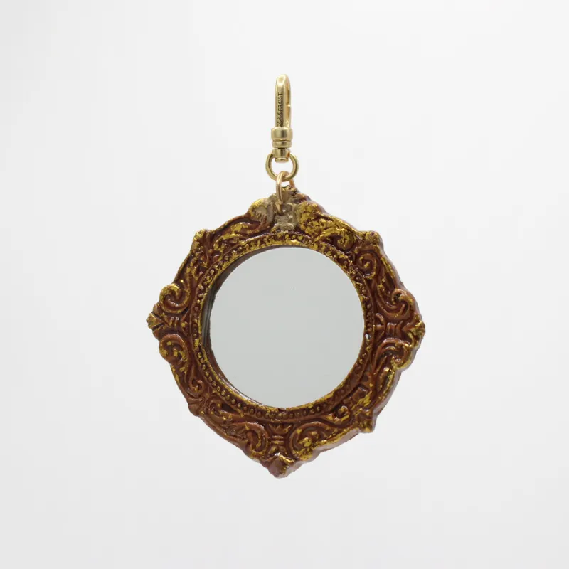 Carved & Gilded Wood Through the Looking Glass Charm sold by Lulu Frost