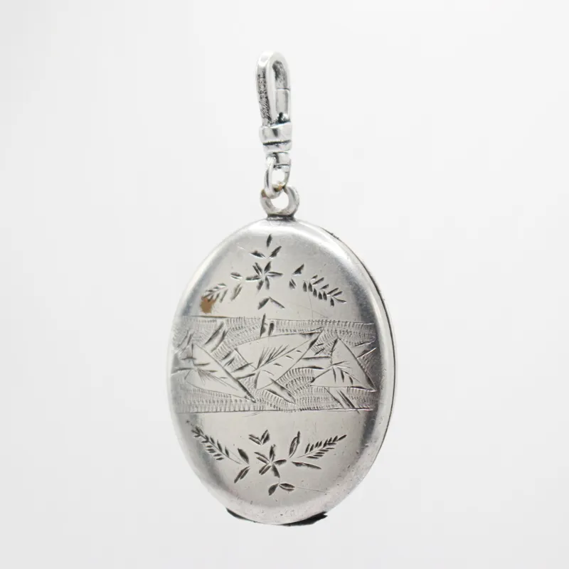 Antique Sterling Oval Floral Locket Charm sold by Lulu Frost