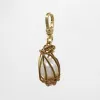 Handmade Nested and Caged Baroque Pearl in Brass & Goldfill Perla Charm sold by Lulu Frost