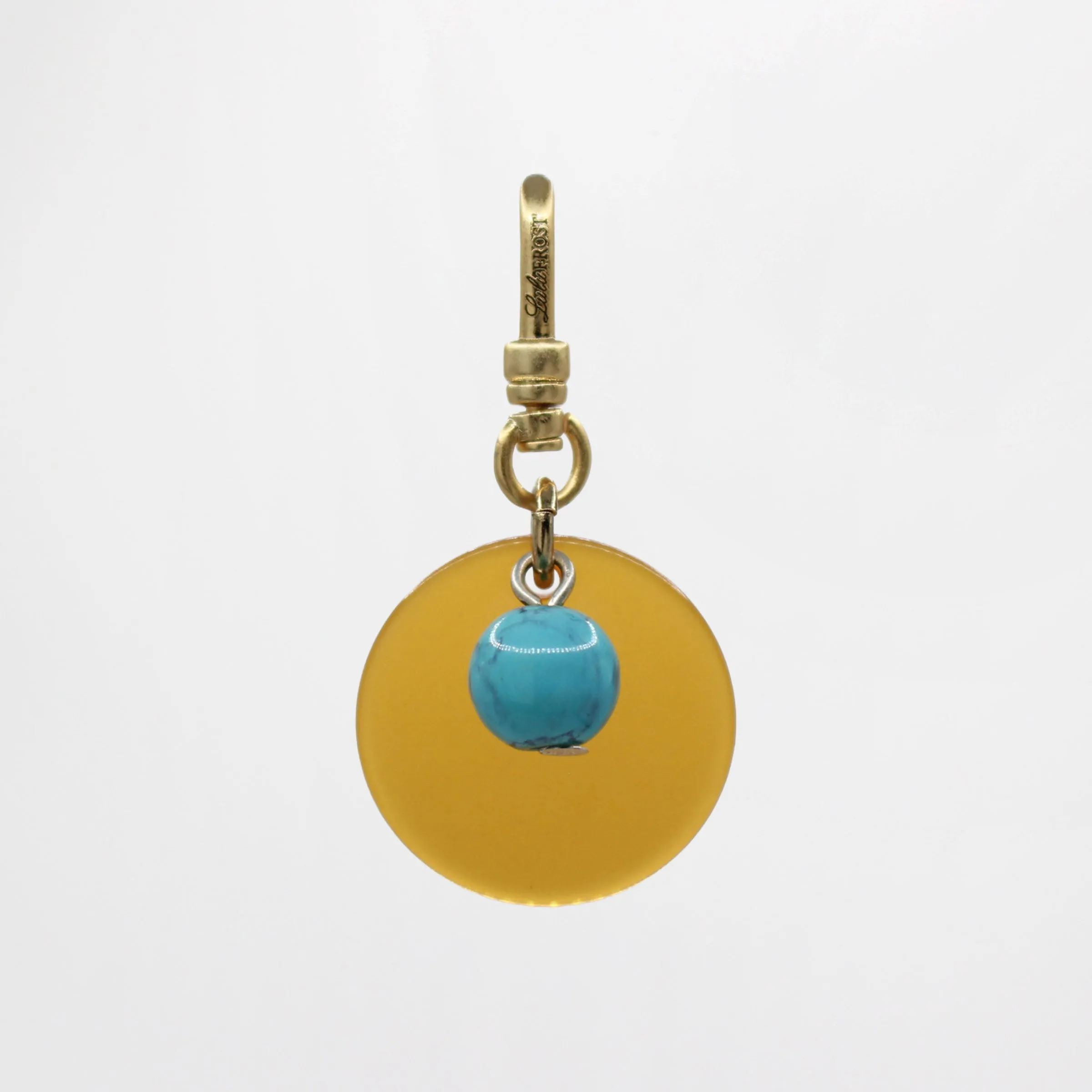 Sun & Moon Saffron Translucent Bakelite with Turquoise Glass Bead Dua Charm sold by Lulu Frost