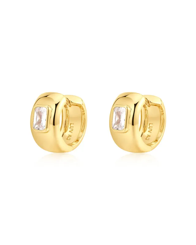 The Emerald Bezel Stone Huggies (Ships Early January) sold by Luv Aj