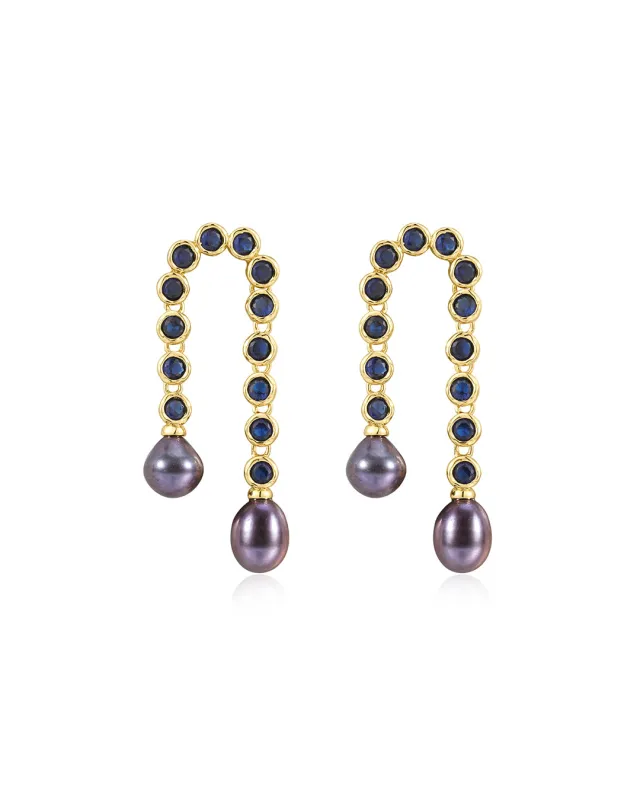 The Pave Blue Pearl U Studs sold by Luv Aj