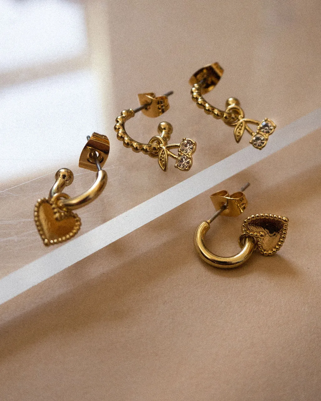 Cherry + Heart Studded Huggies- Gold sold by Luv Aj product image thumbnail 4