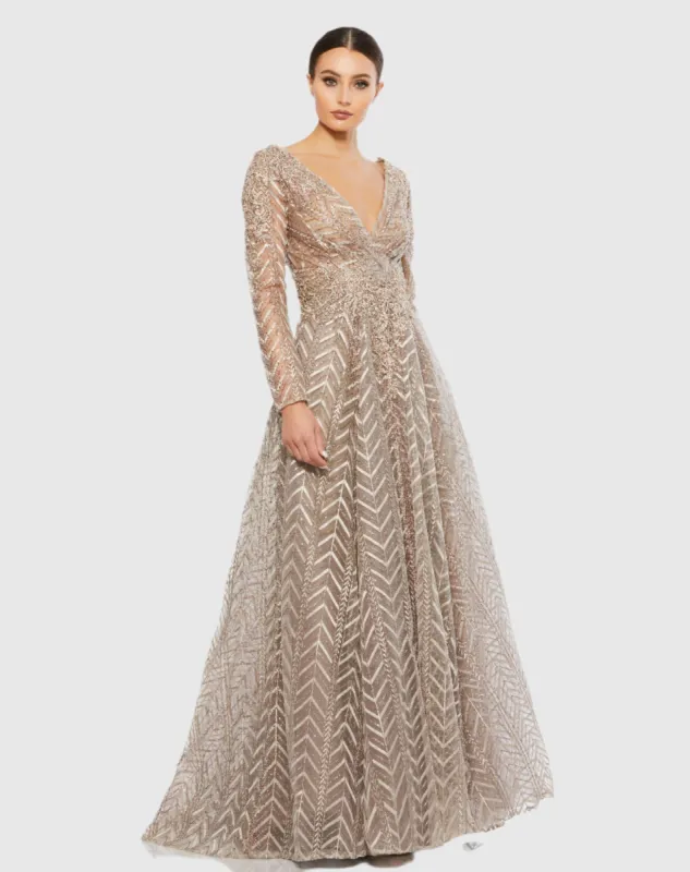 Embellished Illusion Long Sleeve Wrap Over A Line Gown sold by Mac Duggal