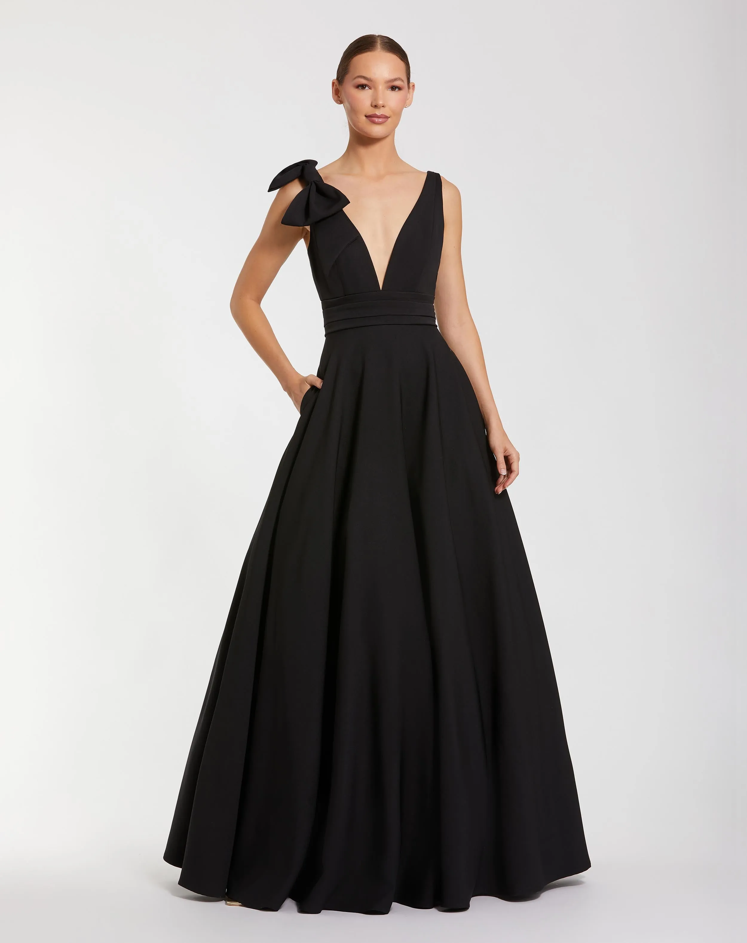 Black Sleeveless Plunge Neck Ball Gown With Bow Detail sold by Mac Duggal