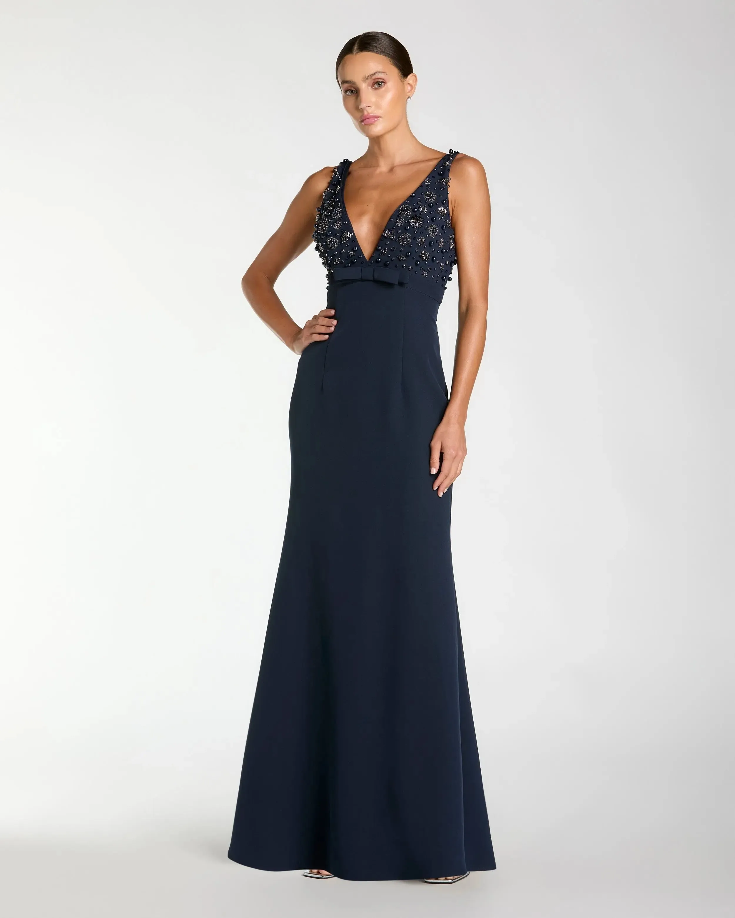 Navy Crepe Sleeveless Beaded V Neck Gown With Bow sold by Mac Duggal