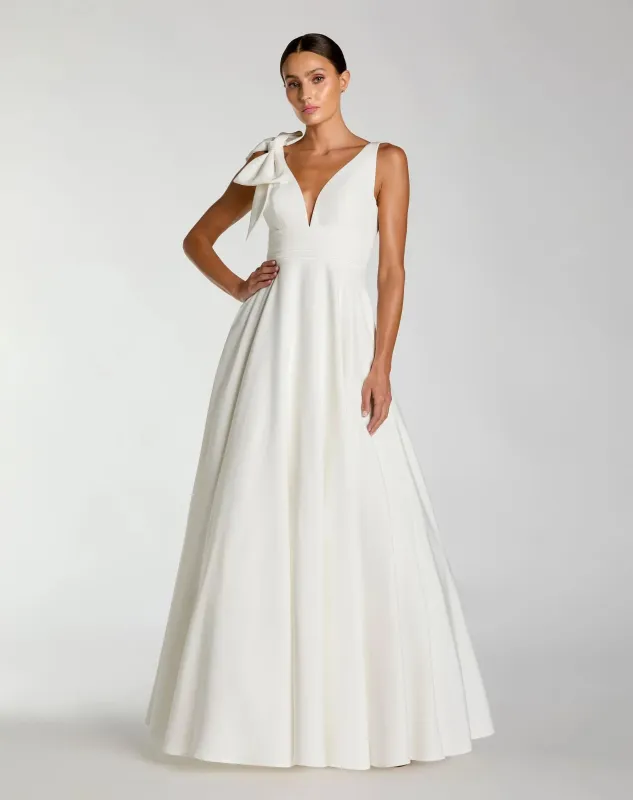 White Sleeveless Plunge Neck Ball Gown With Bow Detail sold by Mac Duggal