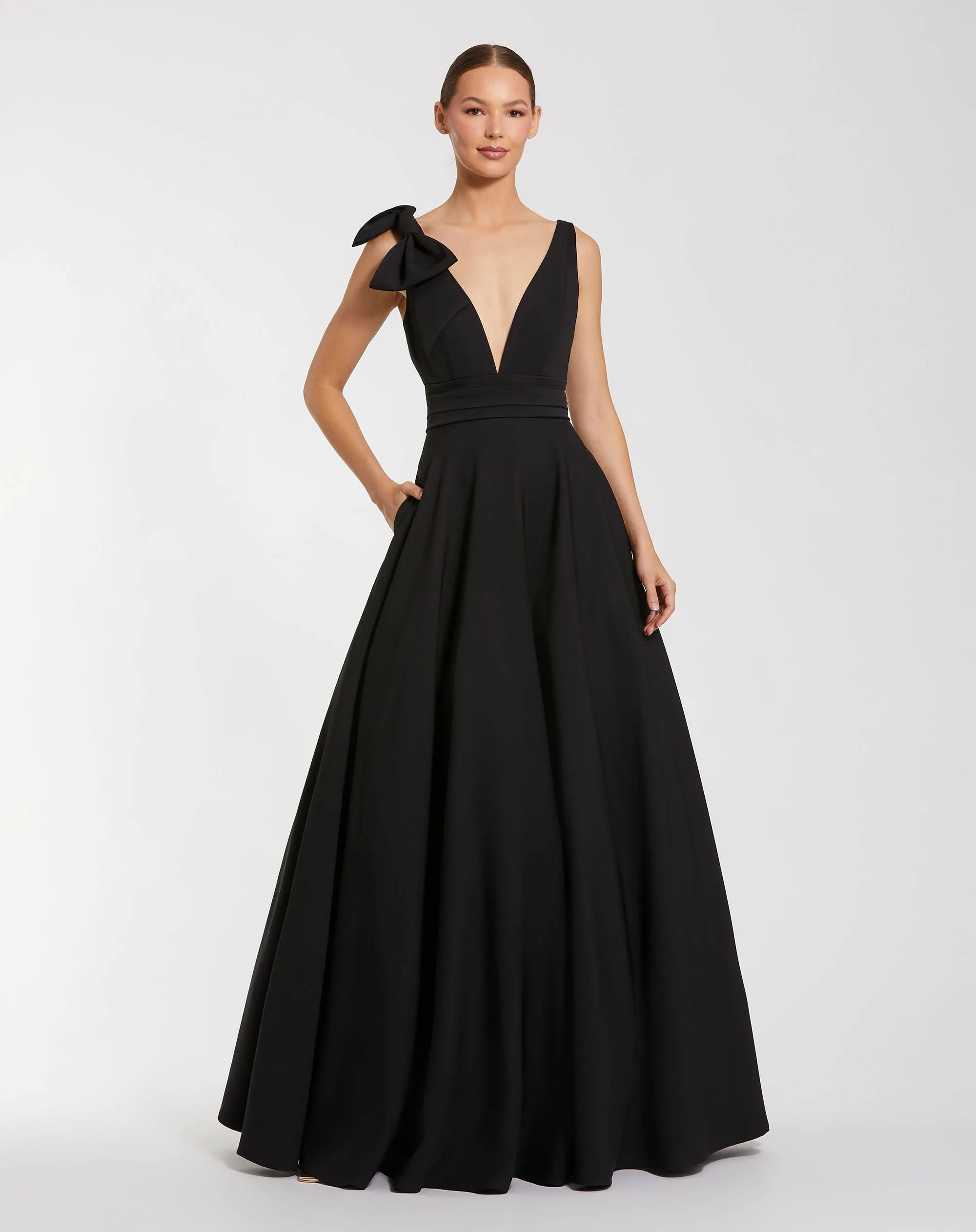 Petite Black Sleeveless Plunge Neck Ball Gown With Bow Detail sold by Mac Duggal