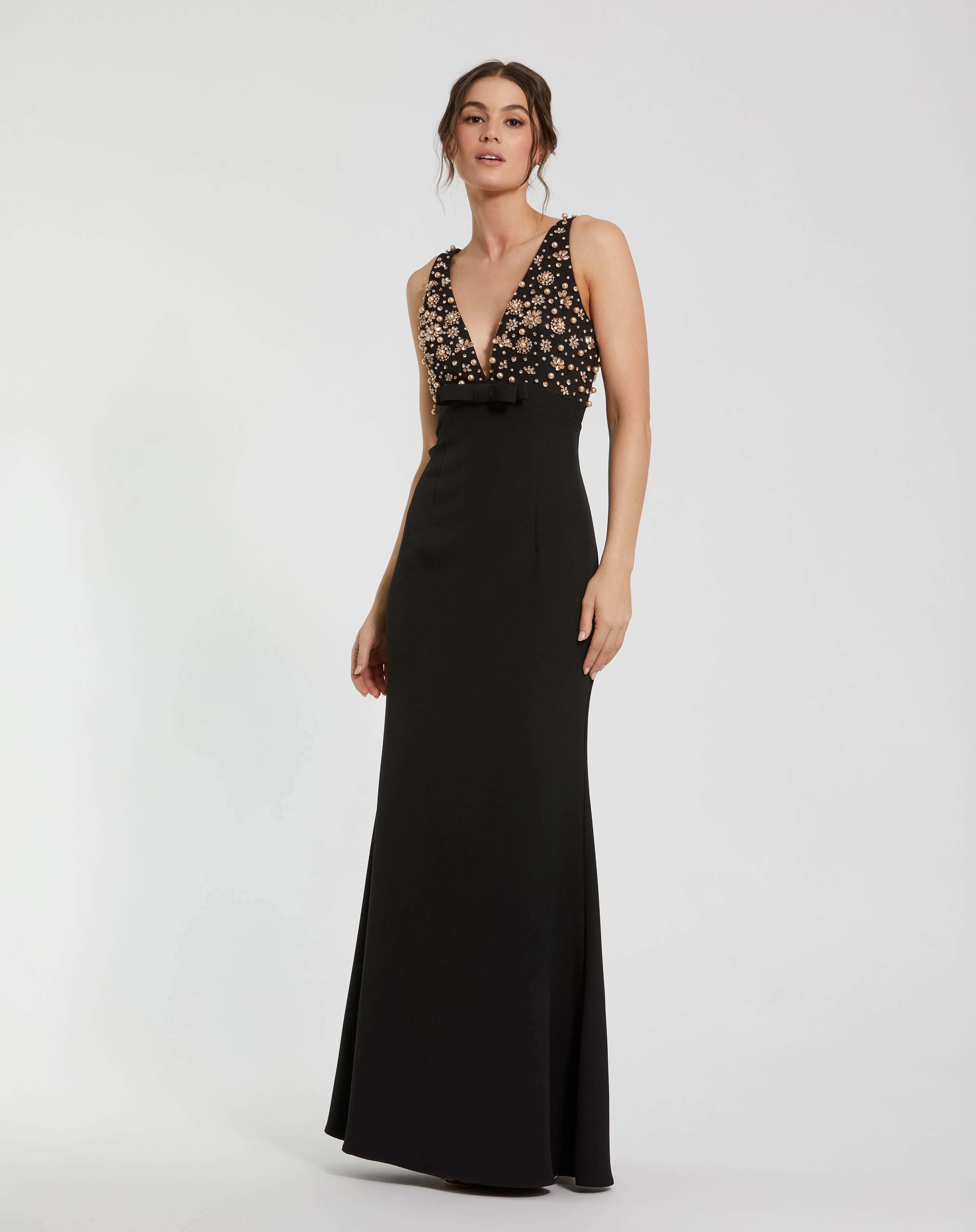 Black Crepe Sleeveless Beaded V Neck Gown With Bow sold by Mac Duggal