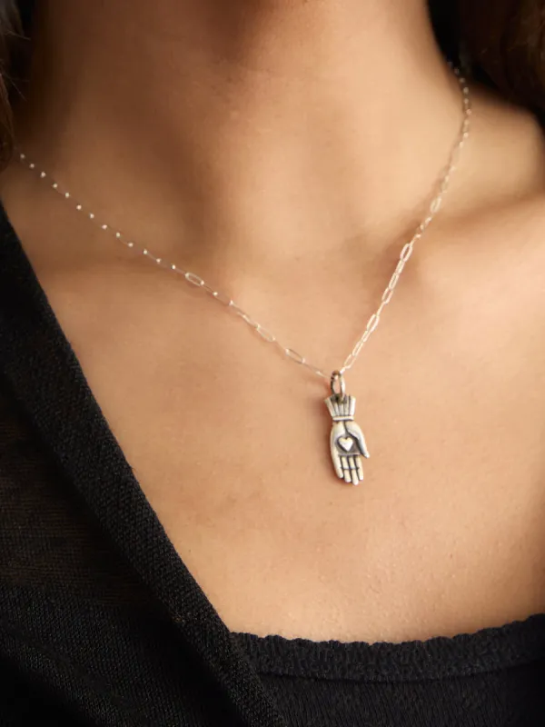 HAND WITH HEART NECKLACE sold by Margaret O'Leary