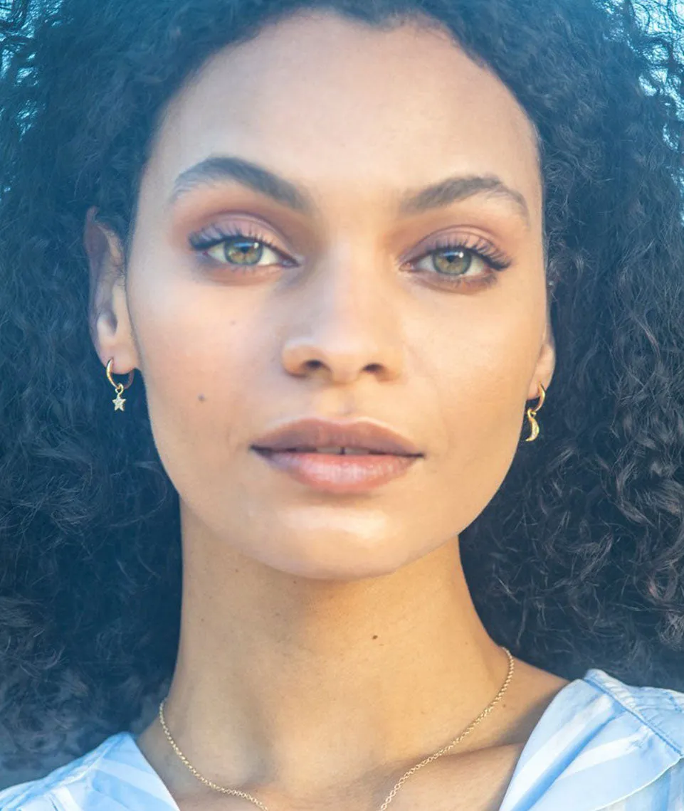 Kris Nations Star + Moon Huggie Hoop Earrings in Gold/Crystal Quartz sold by Marine Layer product image thumbnail 2