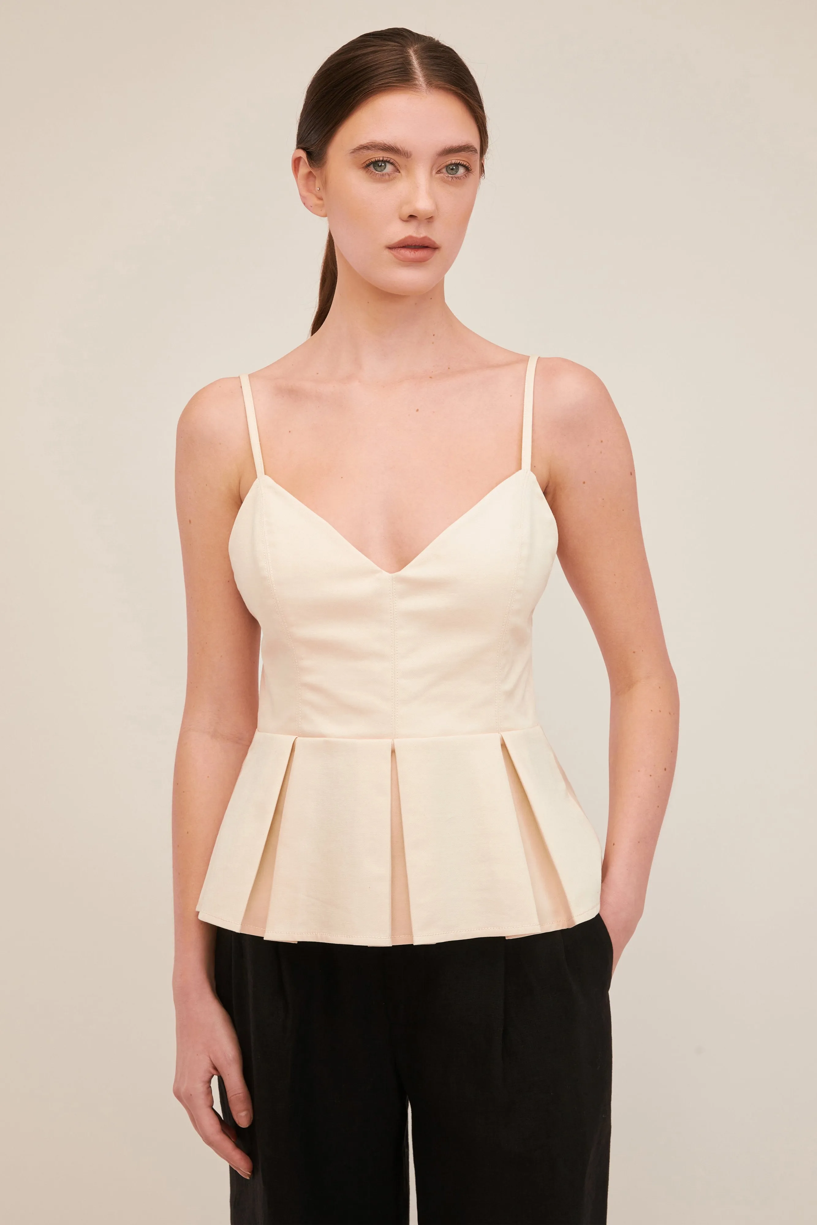 Stretch Pleated Peplum Top in Ivory sold by Marissa Webb