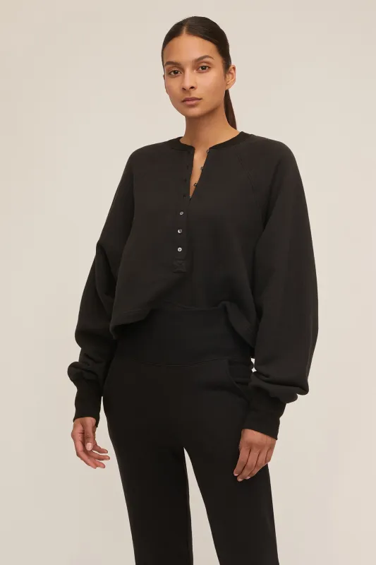 So Uptight French Terry Plunge Henley Sweatshirt in Black sold by Marissa Webb