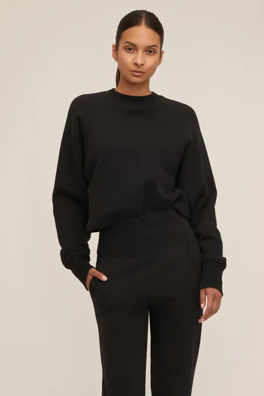 So Uptight Cropped Raglan French Terry Sweatshirt in Black sold by Marissa Webb