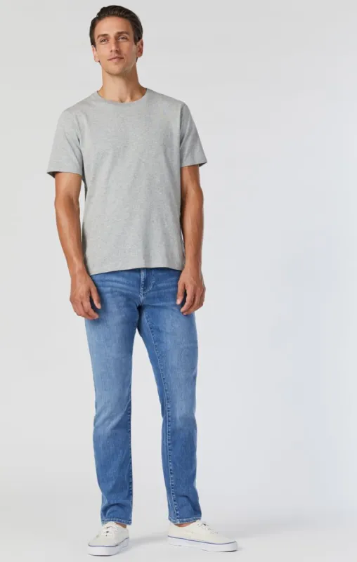 JAKE SLIM LEG JEANS IN LIGHT ATHLETIC sold by Mavi