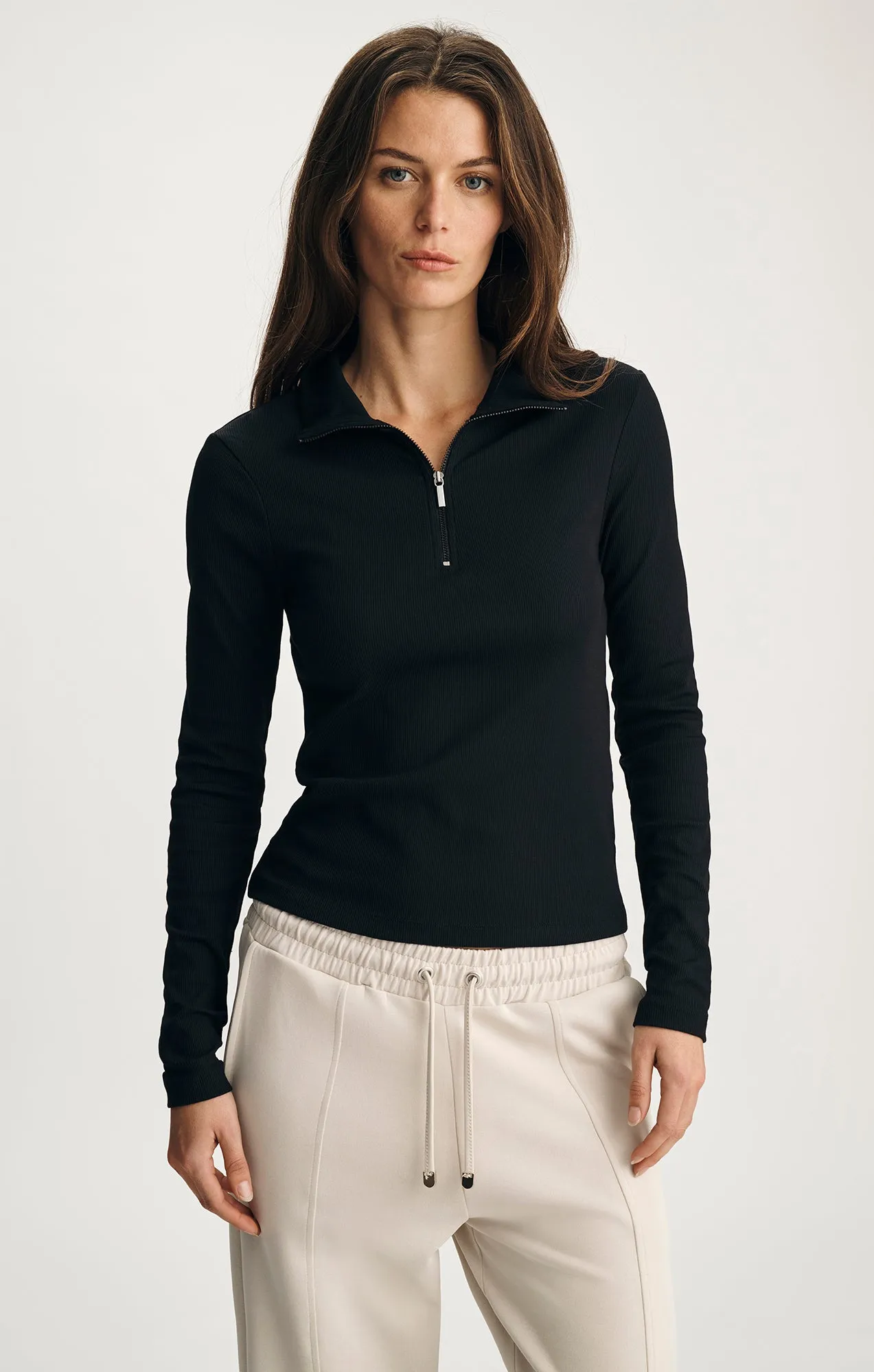SPORTY LUXE HALF ZIP SHIRT IN BLACK sold by Mavi
